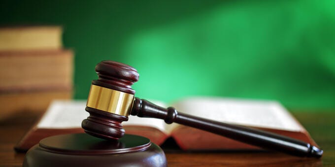 a gavel on a wooden surface